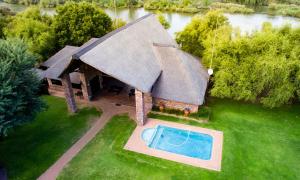 an overhead view of a house with a swimming pool at Elgro River Lodge in Potchefstroom