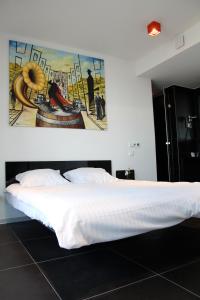 Letto o letti in una camera di Hotel Grey