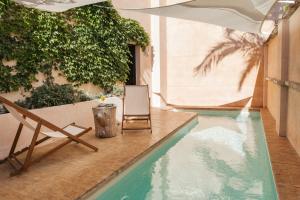 Bazén v ubytování Faustino Gran Relais & Chateaux nebo v jeho okolí