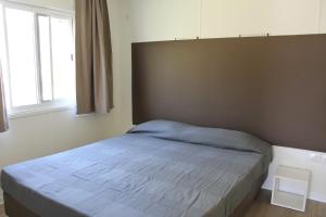 Postel nebo postele na pokoji v ubytování Camping Porto srl