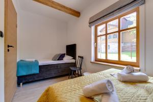 Posteľ alebo postele v izbe v ubytovaní Biała Owieczka B&B Szczyrk