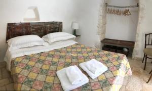 Posteľ alebo postele v izbe v ubytovaní Borgo trulli 1789