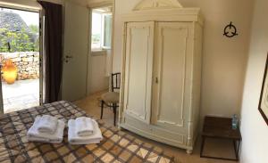 Posteľ alebo postele v izbe v ubytovaní Borgo trulli 1789