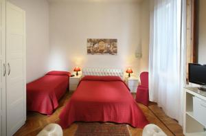 מיטה או מיטות בחדר ב-Hotel Internazionale