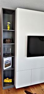 TV a/nebo společenská místnost v ubytování Loft4two