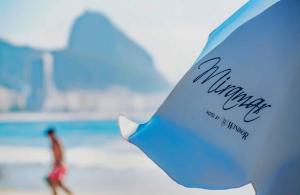 a close up of a sign at the beach at Miramar By Windsor Copacabana in Rio de Janeiro