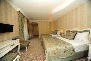 Postel nebo postele na pokoji v ubytování Grand Gocek Hotel