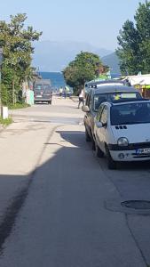 a couple of cars parked on the side of a street at Apartman Jasna in Herceg-Novi