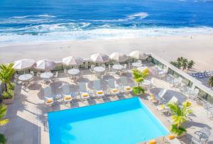 an aerial view of the beach and the pool and the ocean at Windsor Excelsior Copacabana in Rio de Janeiro