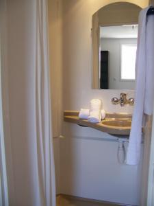 a bathroom with a sink and a mirror at Vanina Park in Corte