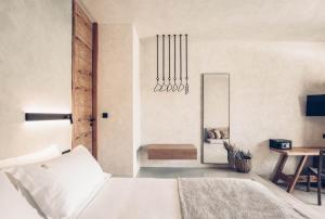 A bed or beds in a room at Monastery Estate Retreat