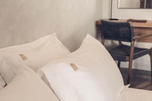A bed or beds in a room at Monastery Estate Retreat