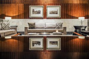 a living room with a couch and a table at Windsor Marapendi Hotel in Rio de Janeiro