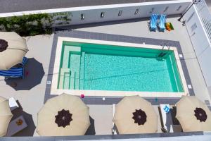 La pileta dentro o cerca de MareinSicilia: Talia Residence