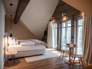 Postel nebo postele na pokoji v ubytování Alpenloge Design Hotel