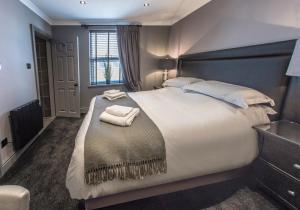 Кровать или кровати в номере N'ista Boutique Rooms Birkdale, Southport