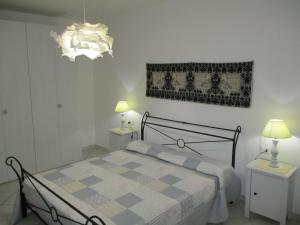 Posteľ alebo postele v izbe v ubytovaní SoleMare Sud Sardegna