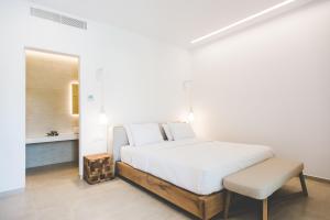 Ein Bett oder Betten in einem Zimmer der Unterkunft Super Paradise Hotel