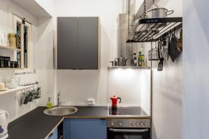 A kitchen or kitchenette at Maironis Apartment