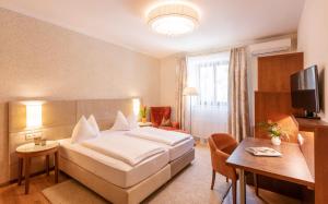 Posteľ alebo postele v izbe v ubytovaní Hotel Mader