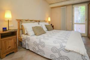 a bedroom with a large bed and a window at Villa Sant'Elena in Morro dʼAlba