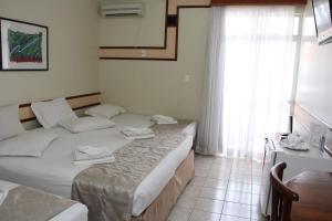 Ένα ή περισσότερα κρεβάτια σε δωμάτιο στο Hotel Taiyo