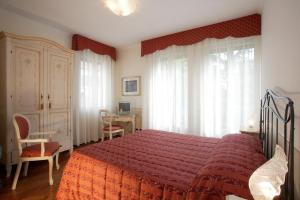 Postel nebo postele na pokoji v ubytování Ca' San Rocco