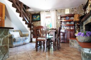 a dining room with a table and chairs at Il giardino del borgo in Rocca Cilento
