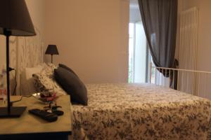 A bed or beds in a room at Villa Lucia B&B