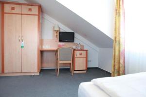 TV a/nebo společenská místnost v ubytování Hotel Wetterau - Self-Check-In