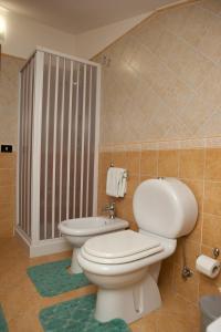 a bathroom with a toilet and a bidet at B&B Casa Mauro in Linguaglossa