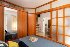 a room with sliding glass doors and a living room at ANAMARIJA APARTMAN in Dubrovnik