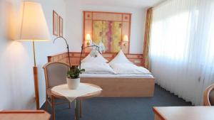 Postel nebo postele na pokoji v ubytování Hotel Wetterau - Self-Check-In