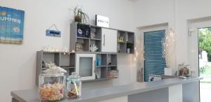 a room with a counter with a shelf at Apartments Ana & Ita in Novalja