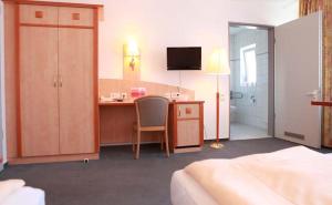 Postel nebo postele na pokoji v ubytování Hotel Wetterau - Self-Check-In