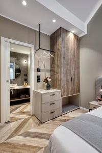 a bedroom with a bed and a bathroom with a sink at Italianflat - Design rooms Verona in Verona