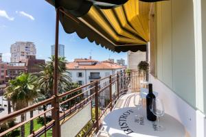 a balcony with a table and a view of the city at Casa Laura Follonica in Follonica