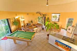 a living room with a pool table in it at Cape Oasis Guesthouse in Bloubergstrand