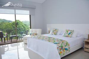 Postel nebo postele na pokoji v ubytování Gyrola Birding Hotel Boutique + 33 fotografií