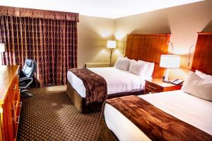 Un pat sau paturi într-o cameră la Mirabeau Park Hotel
