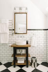 a bathroom with a sink and a mirror at Merrill House in Picton