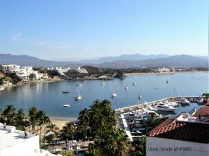 a view of a harbor with boats in the water at Puerto Las Hadas Apartamentos 1065-1063-764 in Manzanillo