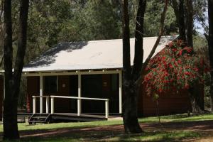 a cabin in the woods with trees at BIG4 Taunton Farm in Cowaramup