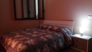 Postel nebo postele na pokoji v ubytování Chalet Reventino