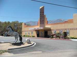 a statue of a horse in front of a building at Trails Motel in Lone Pine