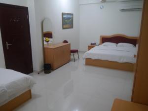 Letto o letti in una camera di Plaza Hotel