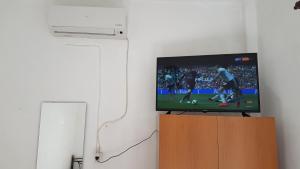 A television and/or entertainment centre at Efstathiou Mihail Studios and Apartments
