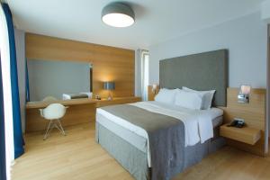 Postel nebo postele na pokoji v ubytování Buzë Boutique Hotel