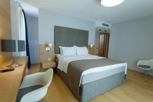 Postel nebo postele na pokoji v ubytování Buzë Boutique Hotel
