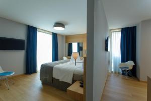 Postel nebo postele na pokoji v ubytování Buzë Boutique Hotel